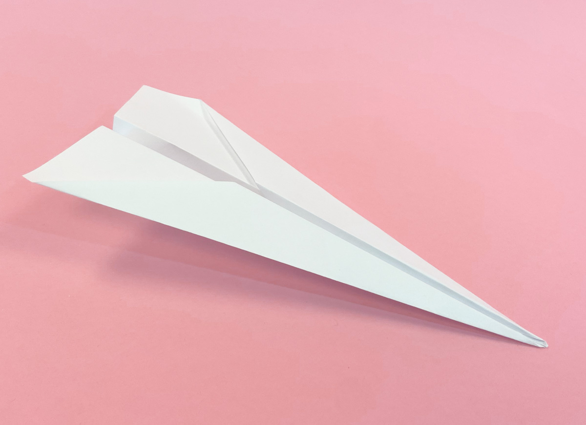 Folded paper airplane.