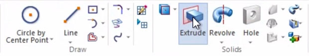 The Extrude tool in the top menu.
